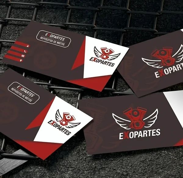 Tarjetas de presentación de Exopartes con el logotipo de motor alado